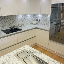 White kitchen with marble worktops